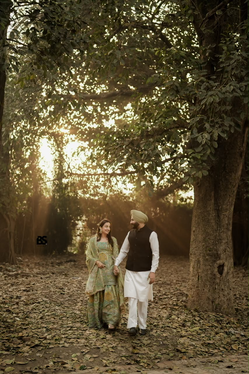 Couple walking together through a golden forest
