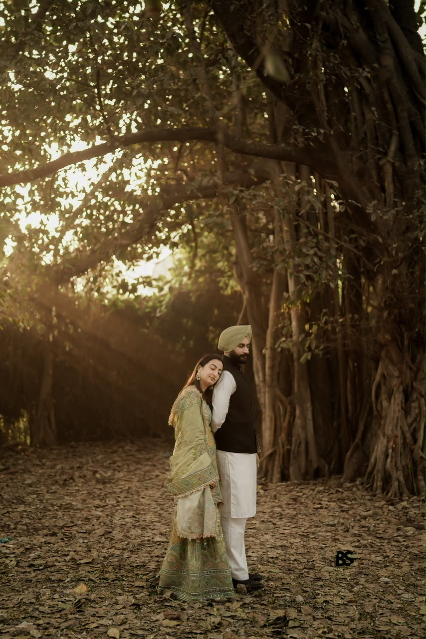 Bride-to-be resting on her partner in the forest